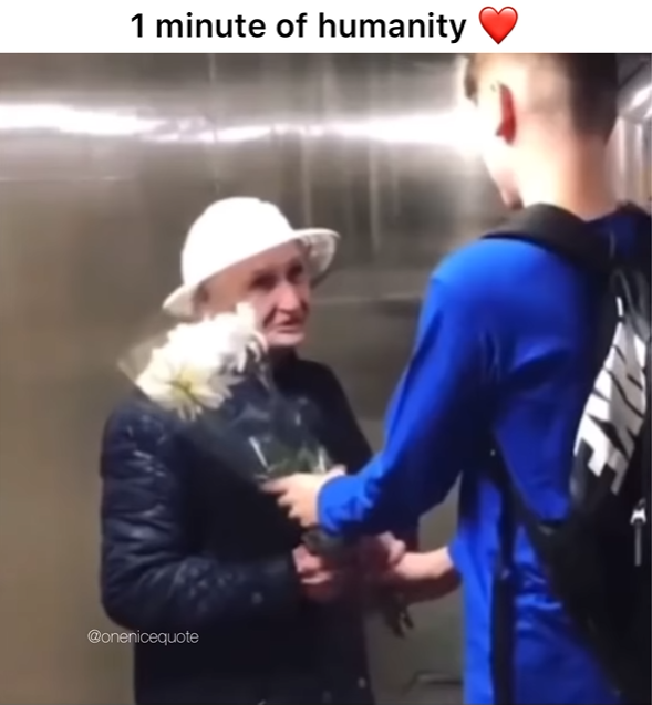 Boy handing an older woman flowers. The title at the top reads: "1 minute of humanity"